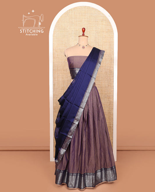 Brown plain cotton half-saree with traditional bordered skirt, matching blouse, and a contrast traditional bordered dhavani