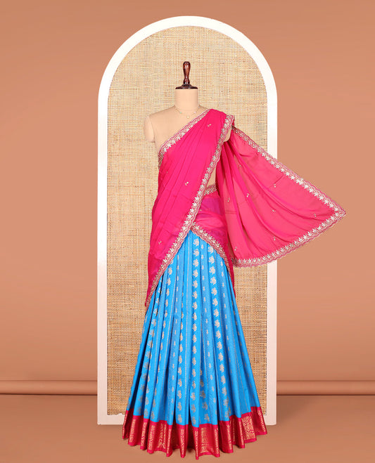 Blue Art Silk Material Half Saree Set, Richly Detailed with Zari Buttas and Stripes on Its Skirt, Complemented by a Contrast Traditional Zari Design Border, Paired with a Contrast Blouse, and Scallop Embroidered Dhavani