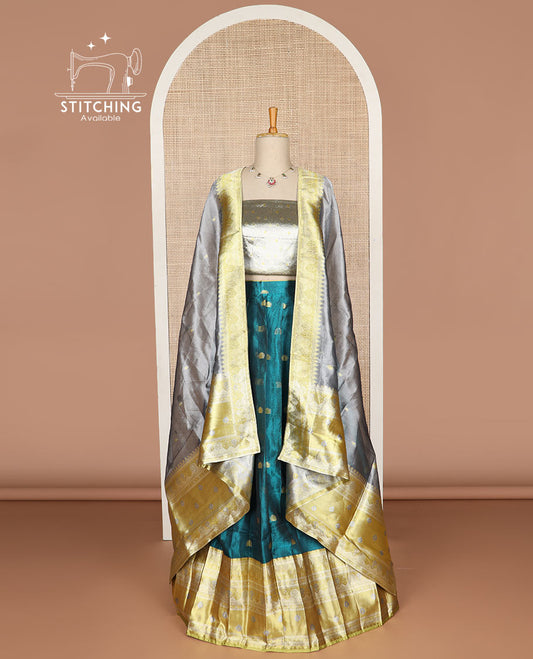 Blue buttas tissue half saree with contrast zari design border, zari design blouse & floral design dhavani