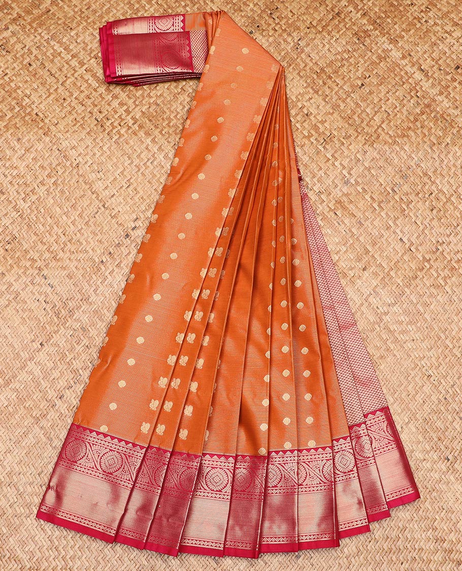 Orange peacock chakram buttas and striped gift saree, contrast traditional zari border, and jaal pallu