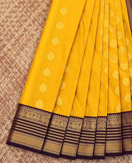 Yellow Budget Silk Saree, Sparsely Woven with Buttas All Over Its Body, Complemented by a Contrast Traditional Zari Design Border, Grand Jaal Pallu, and Paired with a Contrast Blouse