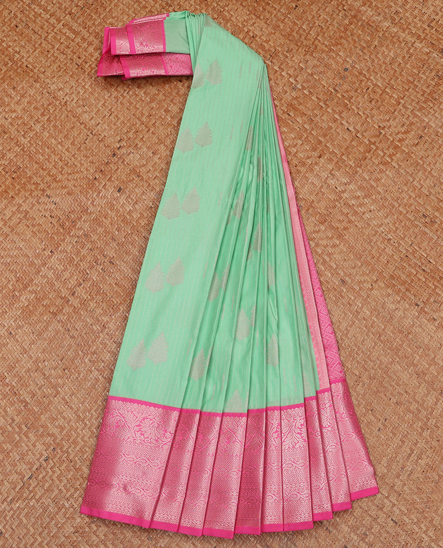 Green Budget Silk Saree Sparsely Sparkled with Tree Buttas and Stripes All Over Its Body, Complemented by a Contrast Border of Traditional Zari Designs, Pallu Gleamed Up with Jaal Designs, and Paired with a Contrast Blouse