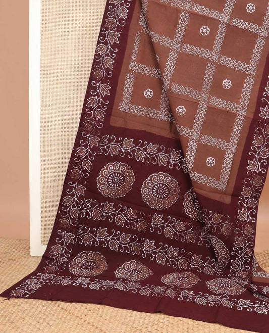 Brown batik-style floral, and checked sungudi cotton saree, contrast floral printed border, and floral-chakra batik printed pallu