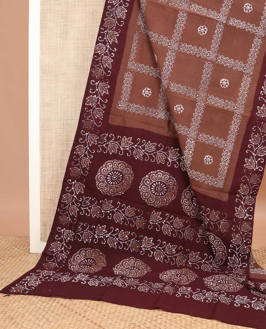 Brown batik-style floral, and checked sungudi cotton saree, contrast floral printed border, and floral-chakra batik printed pallu