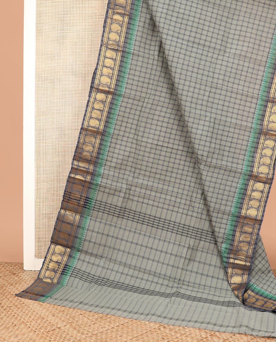 Grey medium-sized checked Chettinad cotton saree, contrast temple border of paisleys, and striped pallu