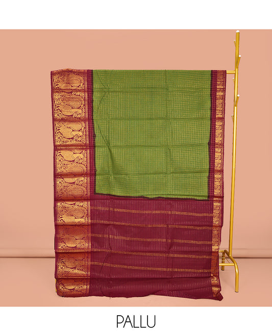 Green Sungudi Cotton Saree, Detailed with Zari Checks on Its Body, Complemented by a Contrast Traditional Zari Border of Big Peacocks, Zari-Striped Pallu, and Paired with a Contrast Blouse
