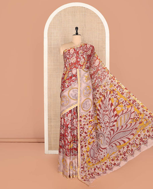Red Machine-Printed Kalamkari Cotton Saree Features Instrument, Floral, and Fauna Motifs, a Contrast  Border, Pallu of Peacock, and a Matching Blouse