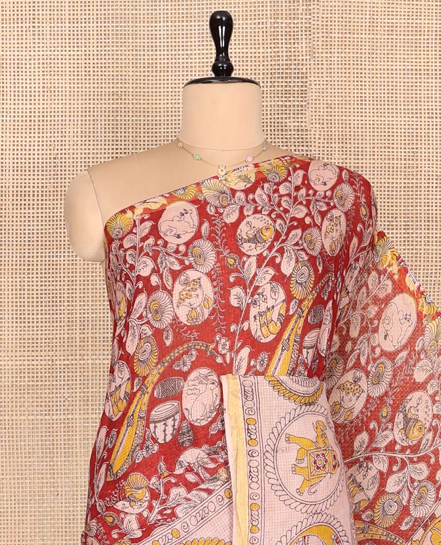 Red Machine-Printed Kalamkari Cotton Saree Features Instrument, Floral, and Fauna Motifs, a Contrast  Border, Pallu of Peacock, and a Matching Blouse