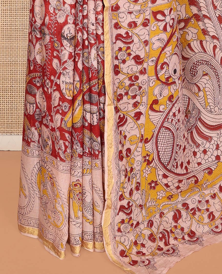 Red Machine-Printed Kalamkari Cotton Saree Features Instrument, Floral, and Fauna Motifs, a Contrast  Border, Pallu of Peacock, and a Matching Blouse