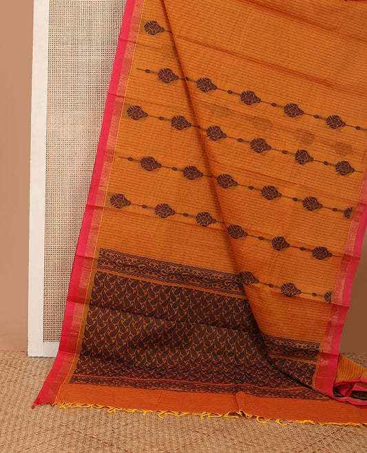 Orange floral striped kanchi cotton saree, contrast zari border & pallu steeped with paisleys