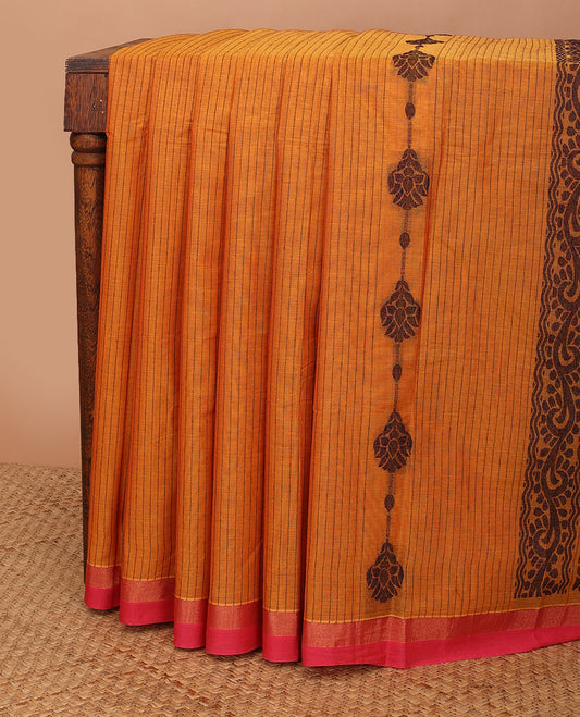 Orange floral striped kanchi cotton saree, contrast zari border & pallu steeped with paisleys