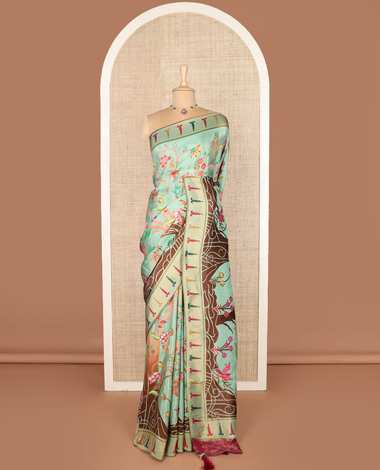 Pastel green colorful floral vine printed dola silk saree, muniya border, and tropical floral printed pallu