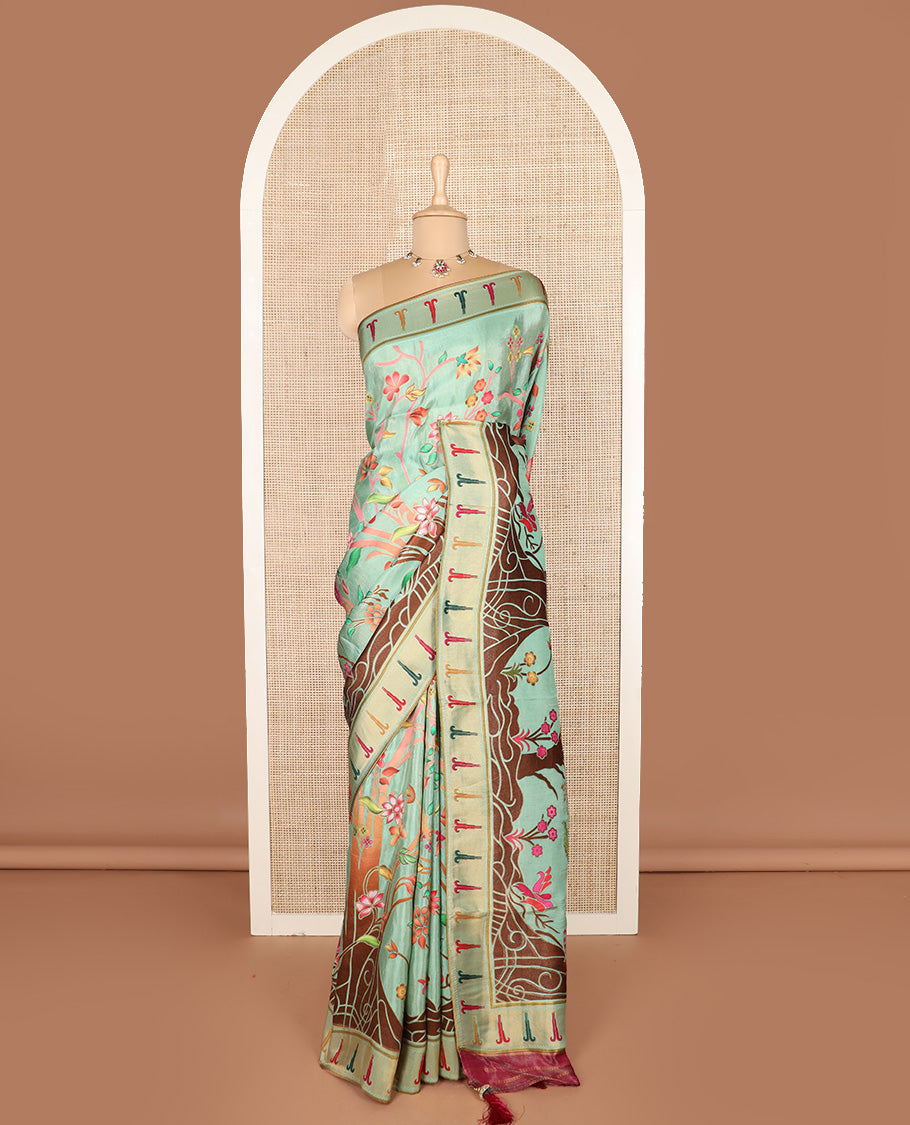 Pastel green colorful floral vine printed dola silk saree, muniya border, and tropical floral printed pallu