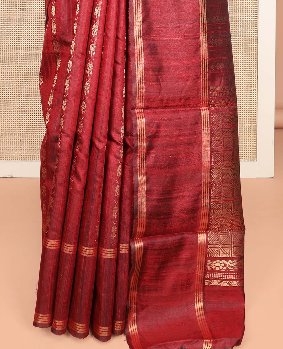 Red Dupion Silk Saree, Richly Detailed with Floral Buttas All Over Its Body, Complemented by a Zari Striped Border, Sparsely Woven Pallu of Intricate Geometric Patterns, and Paired with a Matching Blouse