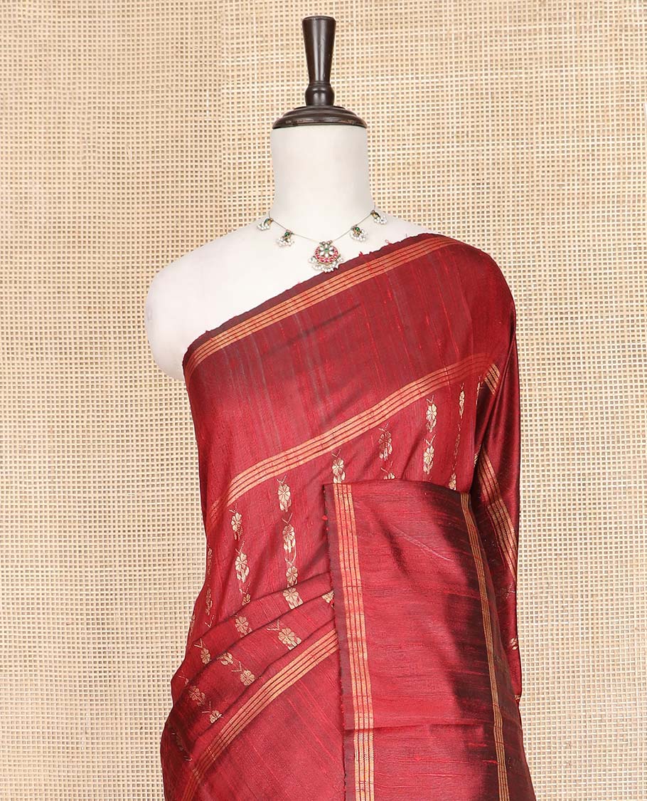 Red Dupion Silk Saree, Richly Detailed with Floral Buttas All Over Its Body, Complemented by a Zari Striped Border, Sparsely Woven Pallu of Intricate Geometric Patterns, and Paired with a Matching Blouse