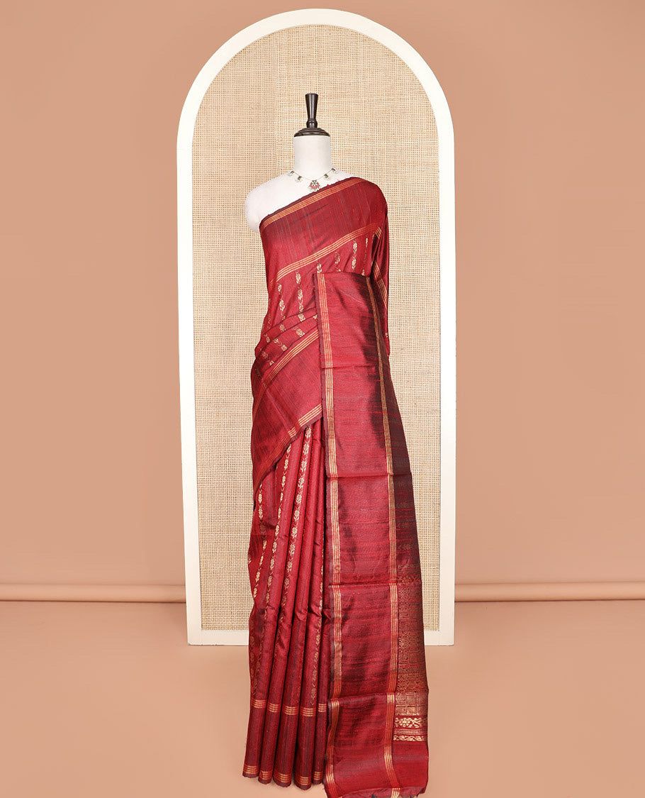 Red Dupion Silk Saree, Richly Detailed with Floral Buttas All Over Its Body, Complemented by a Zari Striped Border, Sparsely Woven Pallu of Intricate Geometric Patterns, and Paired with a Matching Blouse