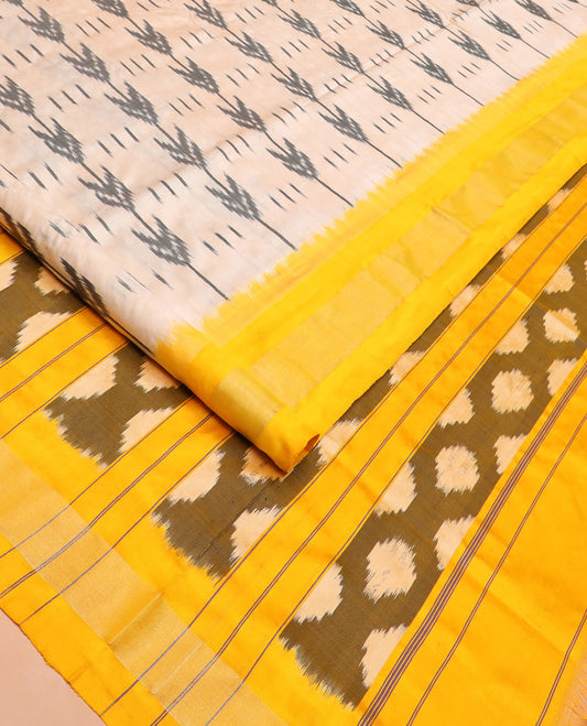 Sandal Ikkat Silk Saree with Ikkat Buttas, Brightened with a Contrast Yellow Border, Pallu Features Ikkat Geometric Patterns, and with a Contrast Blouse