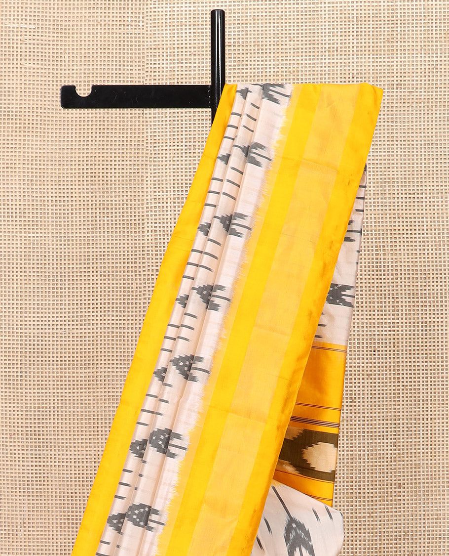 Sandal Ikkat Silk Saree with Ikkat Buttas, Brightened with a Contrast Yellow Border, Pallu Features Ikkat Geometric Patterns, and with a Contrast Blouse