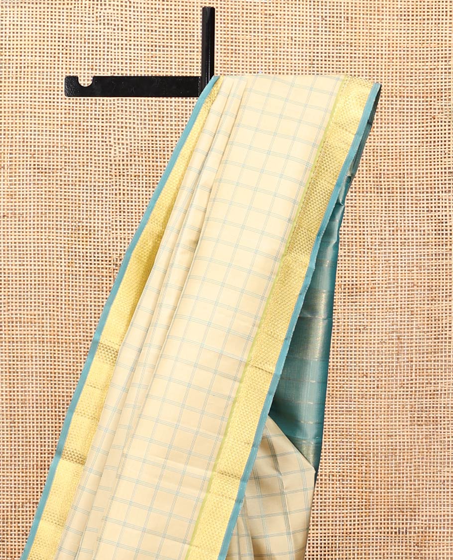 Sandal Kanchipuram Silk Saree, Styled with Checks, Complemented by Contrast Ara Maadam Border, Zari Striped Pallu, and Contrast Blouse