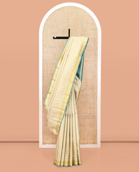 Sandal Kanchipuram Silk Saree, Styled with Checks, Complemented by Contrast Ara Maadam Border, Zari Striped Pallu, and Contrast Blouse