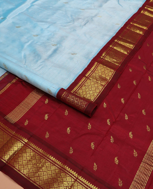 Blue zari buttas Kanchipuram silk saree, contrast one-sided korvai border of thilakam mokku, banaras, and jaal designs, and zari design pallu