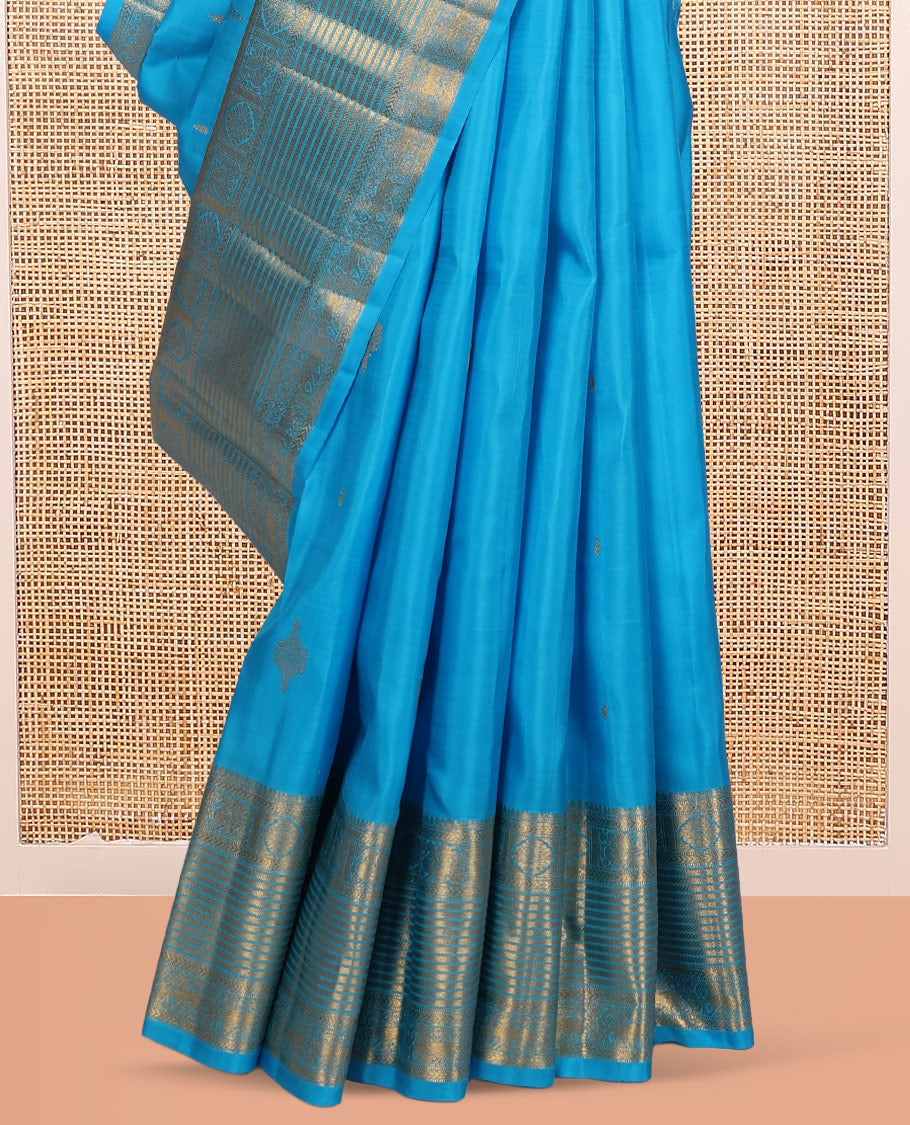 Blue Kanchipuram Silk Saree, Mesmerized with Zari Buttas, Highlighted by Zari Border of Thilakam Mokku, Kathir, Mayil, Chakram, and Yaali, Grand Pallu, and Matching Blouse