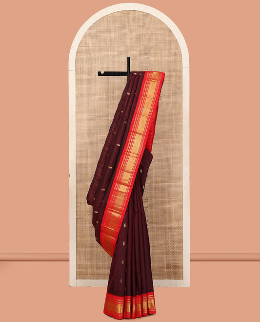 Maroon Kanchipuram Silk Saree, Woven with Zari Buttas, a Contrast One-Sided Korvai Border of Panner Sombu, Banaras, Muthu, and Mayil Kann Designs, a Zari Design Pallu, and No Blouse
