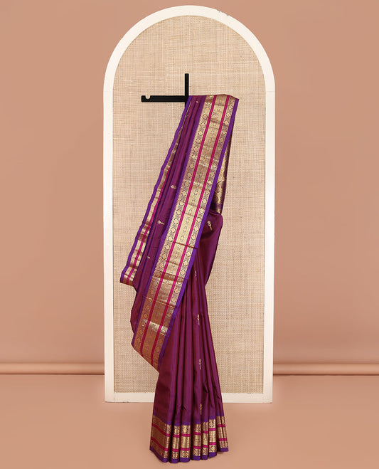 Purple Kanchipuram Silk Saree, Sparsely Woven with Zari Buttas on Its Body, Complemented by a Contrast One-Sided Border of Rekku, Laddu Kamalam, Kathir, and Jada Nagam Designs, Pallu Steeped with Laddu Kamalam Designs, and Comes Without a Blouse
