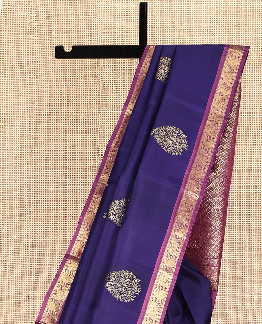 Blue Kanchipuram Silk Saree, Elevated with Zari Buttas All Over Its Body, Complemented by a Contrast Border of Rekku, Muthu, Manga, and Yaanai Designs, Grand Jaal Pallu, and Paired with a Contrast Blouse
