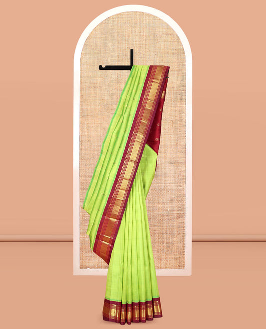 Green Kanchipuram Silk Saree, Woven with Zari Buttas, a Contrast One-Sided Korvai Border of Panner Sombu, Banaras, Muthu, and Mayil Kann Designs, Zari Design Pallu, and a No Blouse