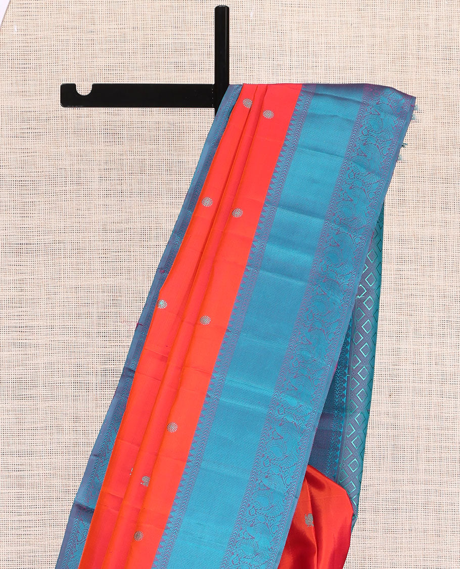Orange Kanchipuram Silk Saree, Woven with Mayil-Chakram Buttas, Complemented by a Contrast Mayil Motif Woven Border, Jaal Pallu, and a Contrast Blouse