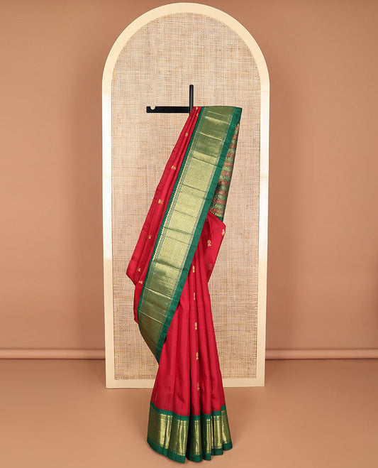 Red buttas kancheepuram silk saree with contrast korvai border of banaras, thilakam mokku, kuyil kann design & floral design pallu