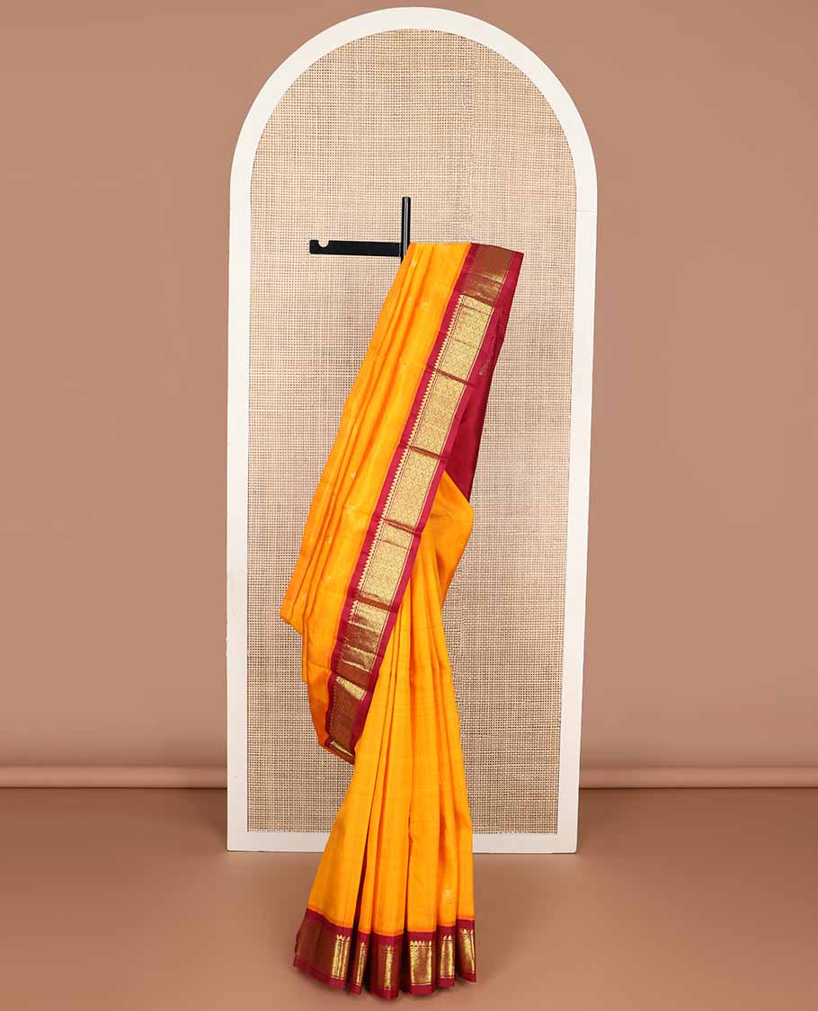 Orange buttas kancheepuram silk saree with contrast korvai zari design border & floral design pallu