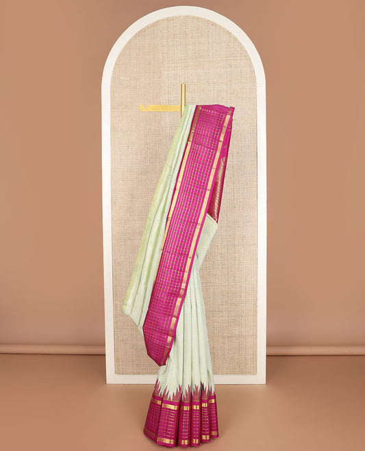 Pale green zari buttas kanchipuram silk saree, contrast one-sided thazampoo rekku muthu kattam border & pallu of zari stripes & thazampoo rekku