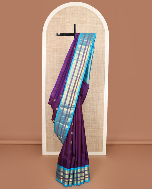 Purple zari buttas Kanchipuram silk saree, contrast one-sided korvai border of thilakam mokku, mayil, and rudraksham designs, and floral design pallu