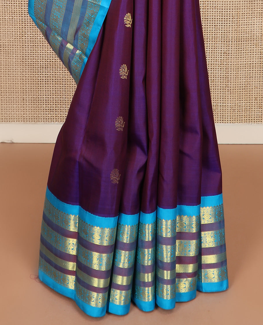 Purple zari buttas Kanchipuram silk saree, contrast one-sided korvai border of thilakam mokku, mayil, and rudraksham designs, and floral design pallu