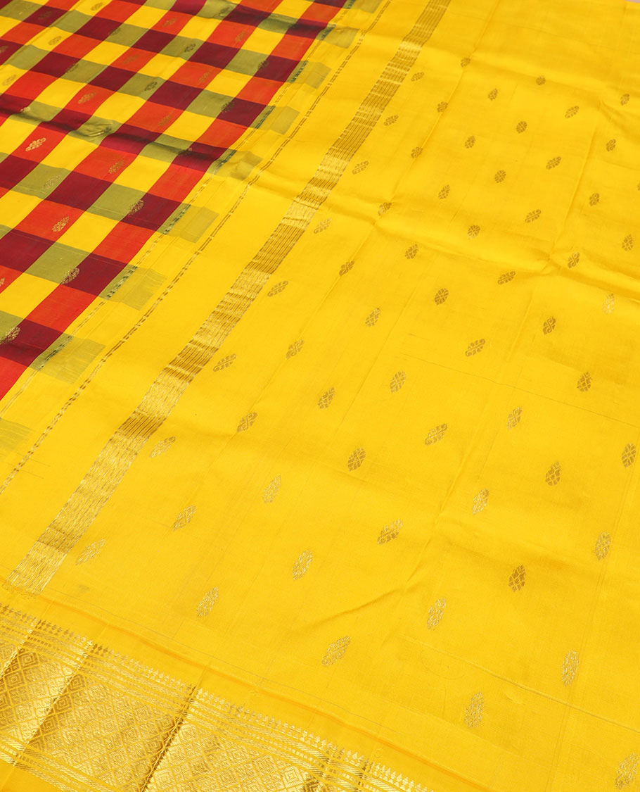 Multi-color zari buttas Kanchipuram silk saree, contrast border of paneer sombu, banaras, muthu, and jaal designs, and zari design pallu
