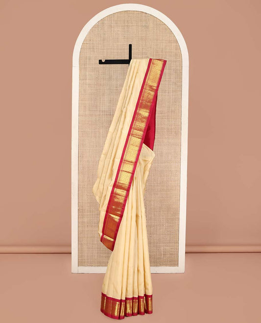 Sandal Kanchipuram Silk Saree, Sparsely Woven with Zari Buttas on Its Body, Complemented by Contrast One-Sided Border of Thilakam Mokku, and Jaal Designs, Pallu of Zari Designs, and Comes Without a Blouse