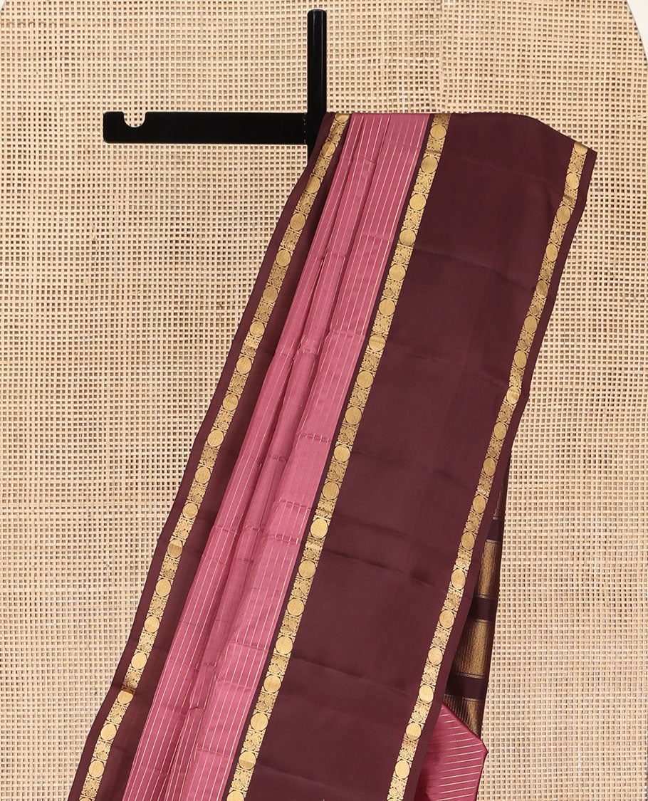 Pink Kanchipuram Silk Saree, Subtly Enriched with Zari Stripes All Over Its Body, Complemented by Contrast Rettai Pettu Border of Mayil and Rudraksham Designs, Gleaming Zari-Striped Pallu, and Paired with a Contrast Blouse