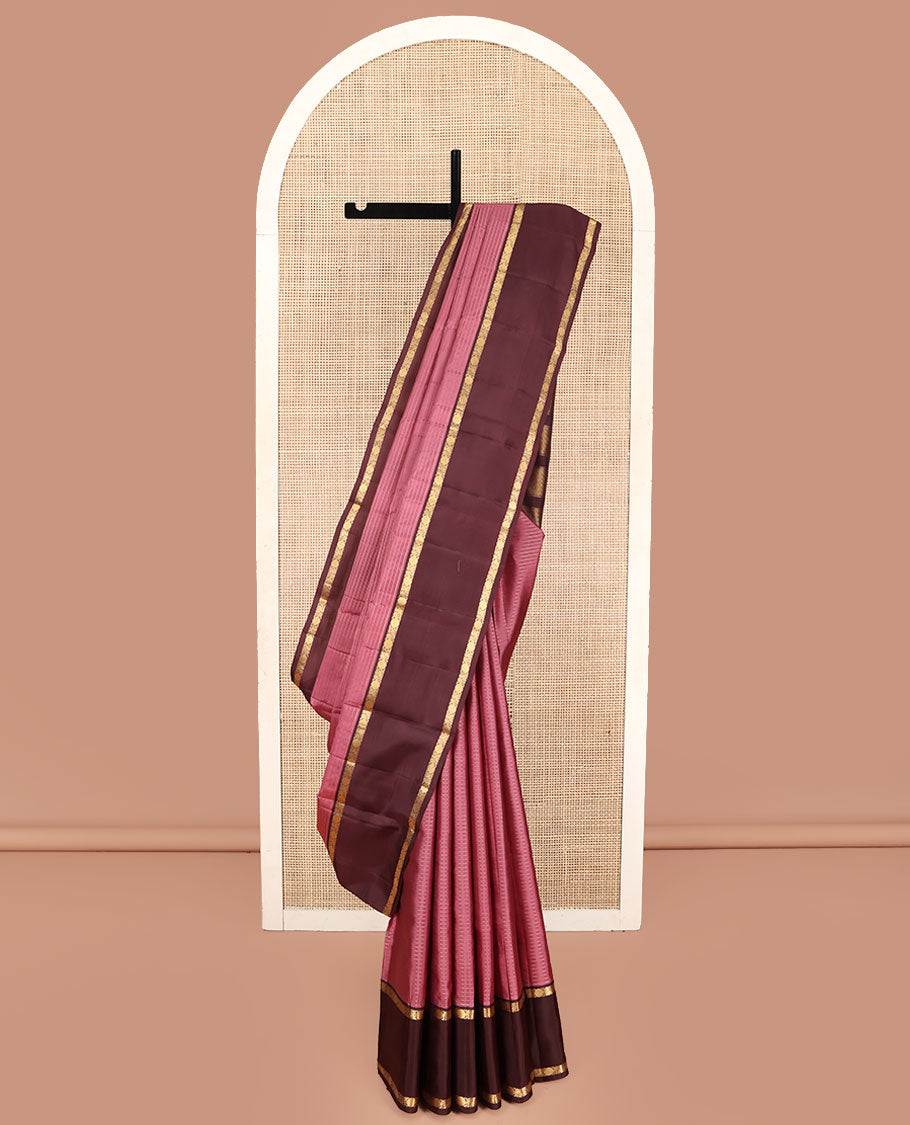 Pink Kanchipuram Silk Saree, Subtly Enriched with Zari Stripes All Over Its Body, Complemented by Contrast Rettai Pettu Border of Mayil and Rudraksham Designs, Gleaming Zari-Striped Pallu, and Paired with a Contrast Blouse