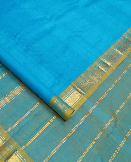 Blue Plain Kanchipuram Silk Saree, Complemented by Contrast One-Sided Border of Rekku, Banaras, and Mayil Kann Designs, Pallu Elevated with Zari Designs, and Comes Without a Blouse