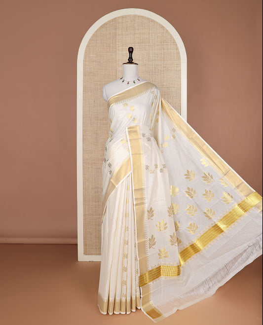 Cream leaf buttas Kerala saree, zari temple border, and pallu of leaf designs