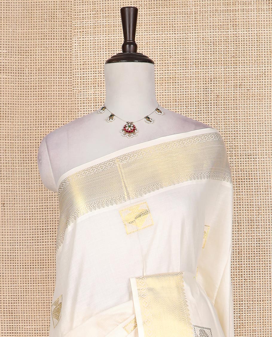 Cream zari buttas Kerala cotton saree, traditional zari border, and intricately designed pallu