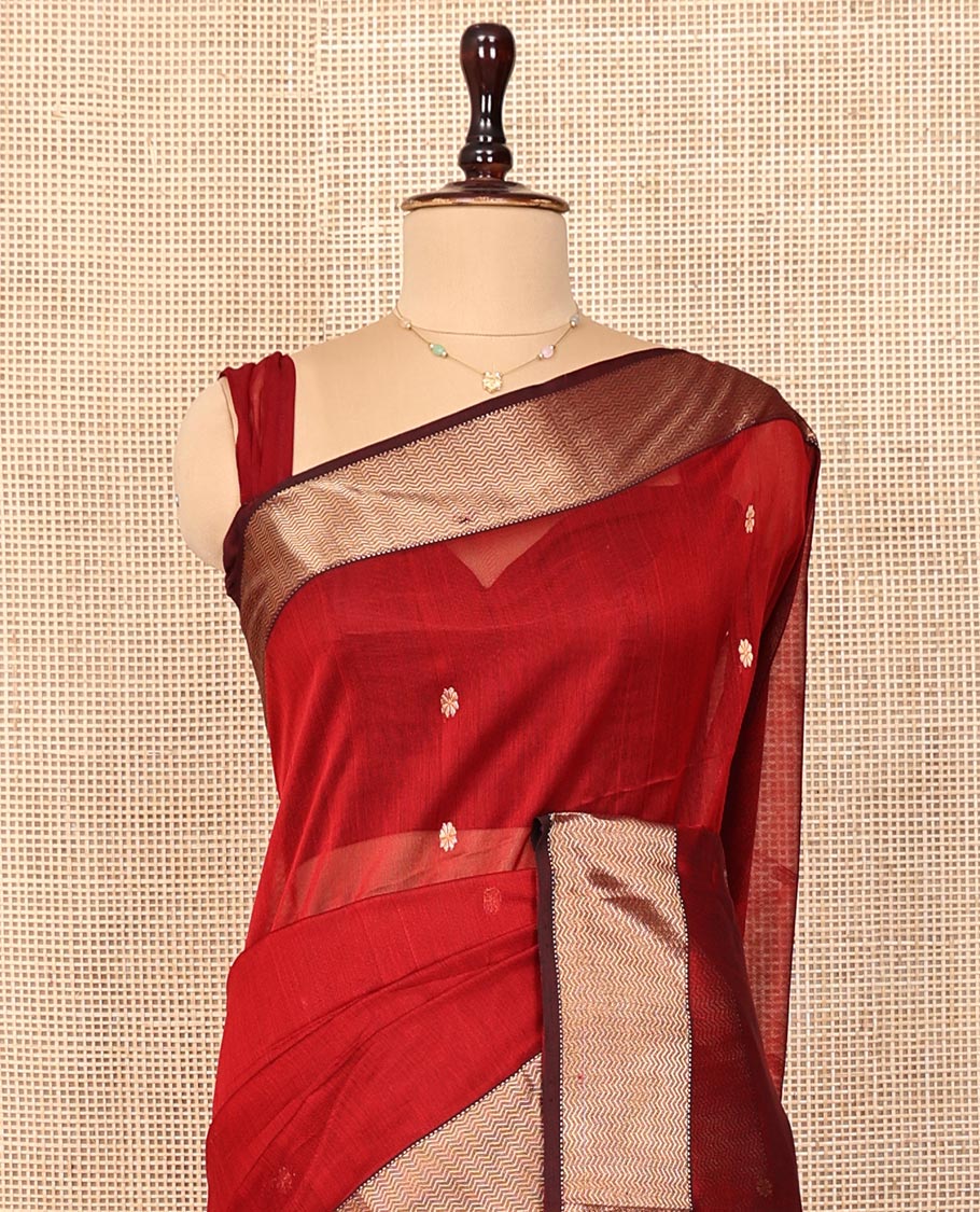 Red Maheshwari Cotton Saree, Spotlighted with Floral Zari Buttas on Its Body, Complemented by a Contrast Chevron Striped Zari Border, Pallu Woven in Chevron Stripes in Zari, and Paired with a Matching Blouse