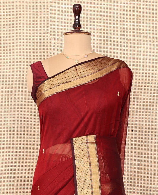 Red Maheshwari Cotton Saree, Accentuated with Zari Buttas All Over Its Body, Highlighted by a Traditional Zari Border, Captivating Contrast Pallu of Floral Designs, and Paired with a Contrast Blouse