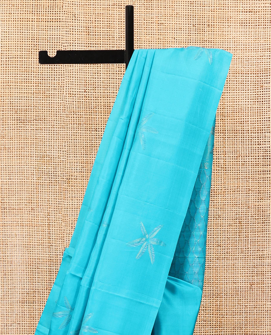 Borderless Blue Mayuri Soft Silk Saree, Sparsely Woven with Floral Buttas All Over Its Body, Sparsely Sparkled Pallu, and Paired with a Matching Blouse
