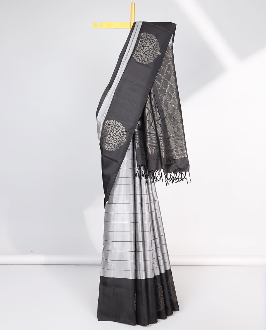 Grey checked Mayur soft silk saree with contrast leaf motifs border & argyle pattern pallu