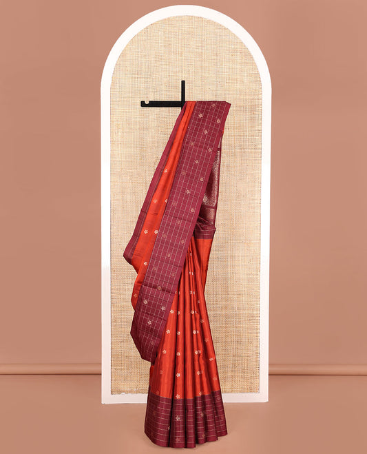 Orange Mayuri Soft Silk Saree, Beautified with Floral Buttas on Its Body, Complemented by Contrast Border of Butta Enclosed Checks, Subtle Pallu of Intricate Designs, and Paired with Contrast Blouse