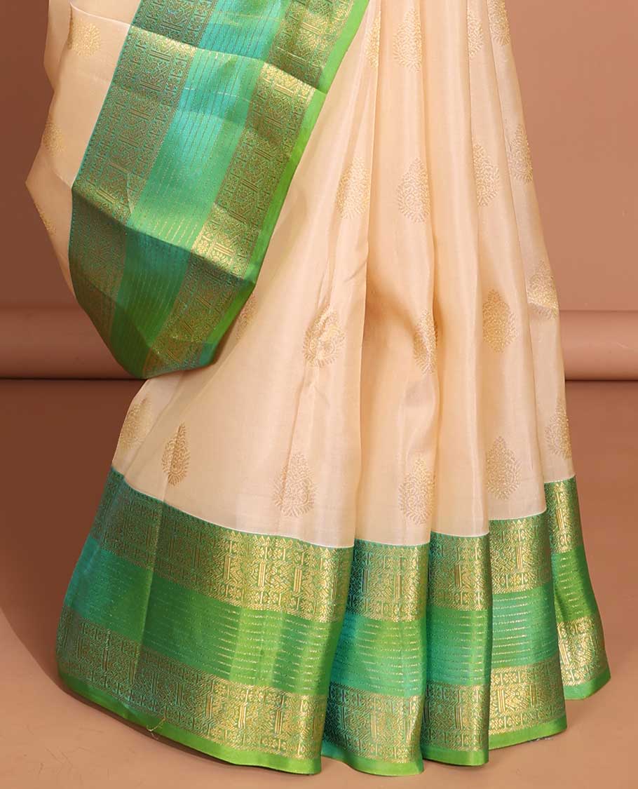 Cream buttas vasundhara elite silk saree with contrast zari design border & pallu of intricate zari design