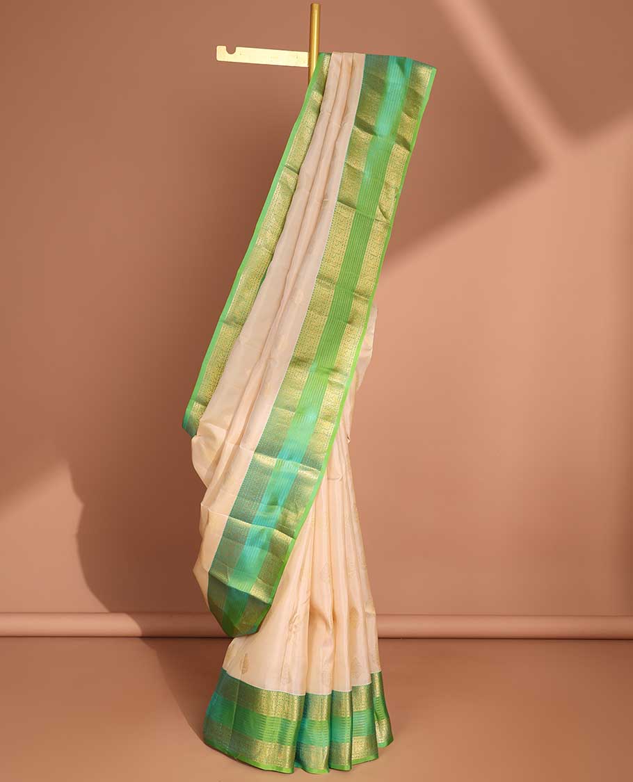 Cream buttas vasundhara elite silk saree with contrast zari design border & pallu of intricate zari design